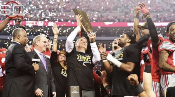 Former Ohio State head coach Urban Meyer poses after winning the 2015 national championship. Meyer now works as a sports commentator. 